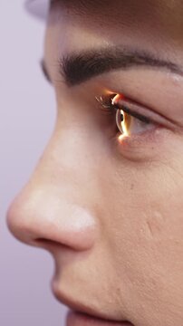 Close-up of a female patient undergoing a diagnostic slit lamp examination, showcasing the eye's detailed structure and illumination in a clinical setting