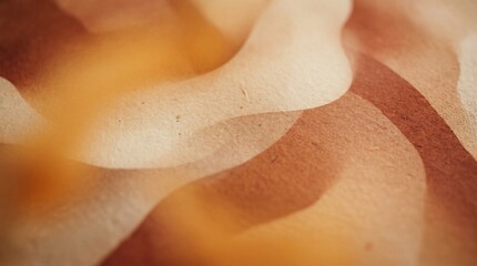 Fototapeta premium Abstract flowing organic shapes in warm earthy tones with subtle texture and soft focus