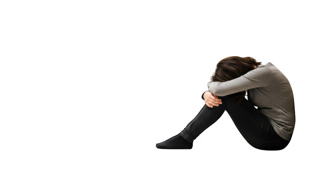 Young woman sitting alone feeling sad.