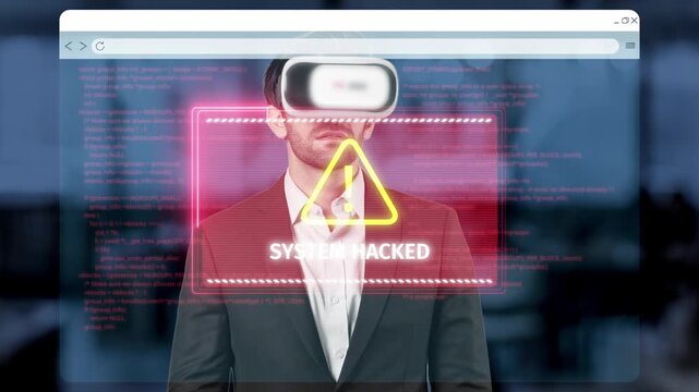 A man wearing a virtual reality headset stands in front of a computer screen displaying a serious system hack alert, reflecting technology and cybersecurity themes. Raster