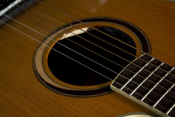 Fototapeta premium This is a close-up of the strings of an acoustic guitar.