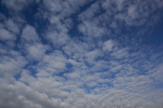 The sky is covered with fluffy clouds