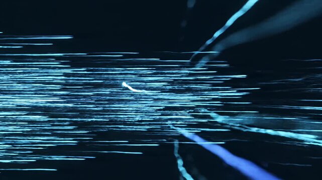 Horizontal blue light streaks on black background.