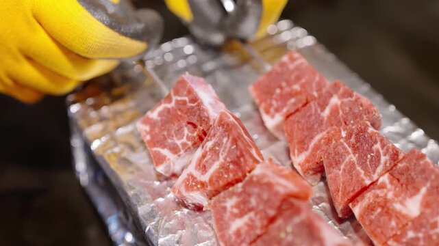 High-quality raw Japanese Wagyu beef steaks, specifically Karubi or Rib Eye cuts, featuring exceptional white marbling and fat distribution. The meat is prepared for fine dining, Yakiniku, or Japanese