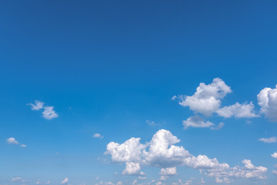 Clear Blue Sky with Soft White Clouds and Bright Natural Daylight Background, Beautiful Clear Blue Sky with Soft White Clouds and Ample Copy Space
Clear blue sky with soft white clouds on a bright sun