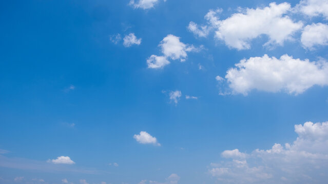 Clear Blue Sky with Soft White Clouds and Bright Natural Daylight Background, Beautiful Clear Blue Sky with Soft White Clouds and Ample Copy Space
Clear blue sky with soft white clouds on a bright sun