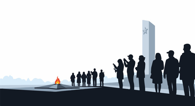 A group of people standing near a monument and a fire pit