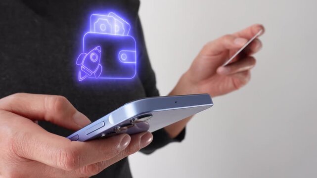 Business profitability. Businesswoman holding a bank card while holding a smartphone with a virtual wallet icon and a rocket.