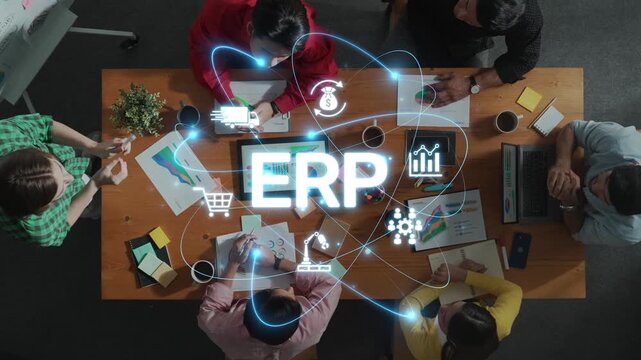 Professionals engage in a dynamic meeting atmosphere focused on ERP solutions, fostering collaboration and innovation to enhance business efficiency and growth. Raster
