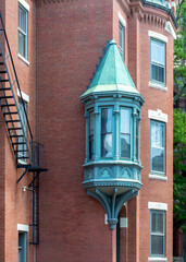 Historic bay window with copper turret on red brick building in Charlestown, Boston  © Baharlou