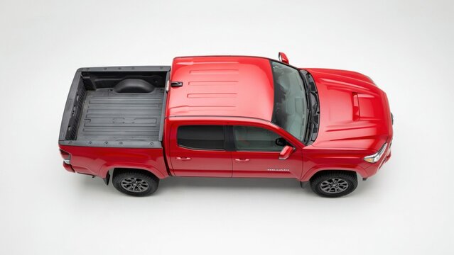 Top view of a red pickup truck isolated on white background