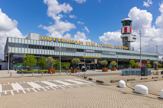 Rotterdam, Netherlands - 10 June 2026 - Exterior view of the main departures terminal building and the iconic red and white control tower at Rotterdam The Hague Airport.