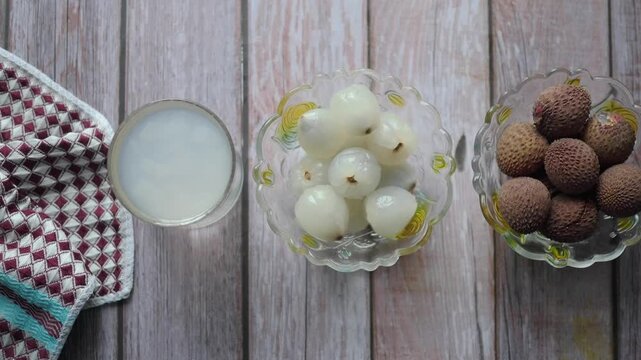 Fruit display with lychee and longan on a wooden table