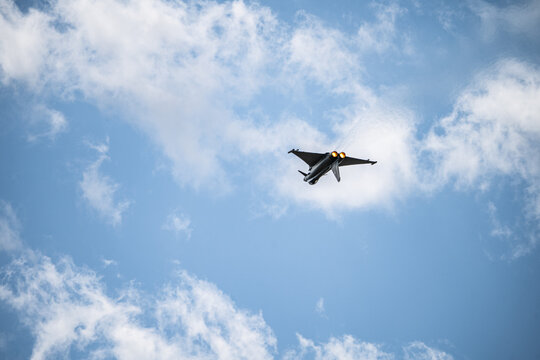 Berlin, Germany - 13 June 2026: View of Eurofighter Typhoon performing an aerial display at the ILA Berlin Air Show against a bright blue sky with scattered clouds.