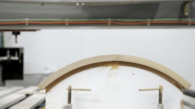 Automatic cutter replacement process on CNC woodworking machine. Industrial manufacturing, automation and modern wood processing technology.