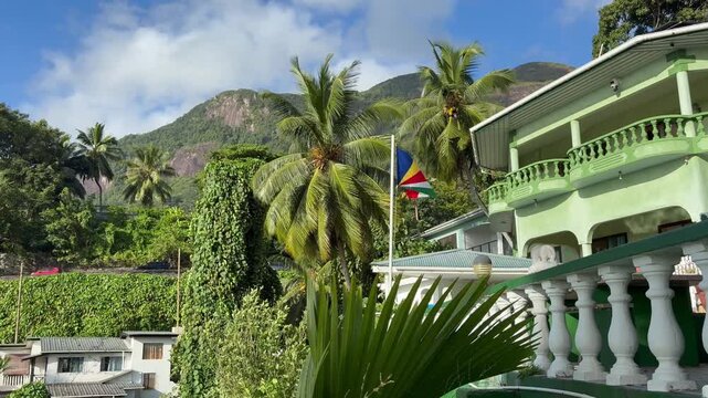 Flag of Seychelles waving in a colonial house of Mahe