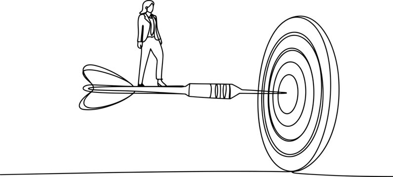 Businesswoman standing on dart hitting bullseye on target