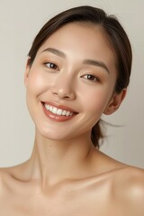 Obraz premium Beautiful young Asian woman with healthy glowing skin portrait.
