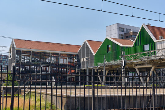 Zaandam, North Holland, Netherlands - 16 June 2026: View of the trainstation and bike parking and colorful Zaan-style architecture near the city hall featuring stacked house facades.