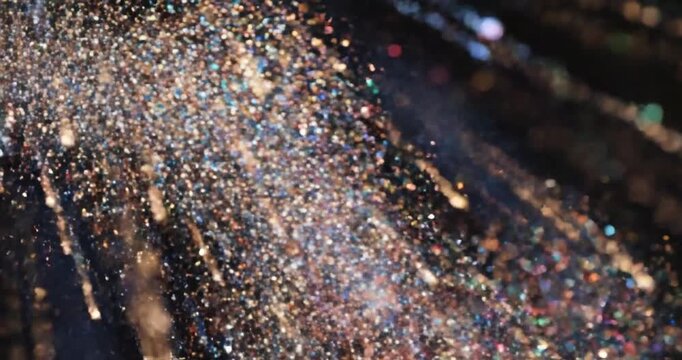 Sparkling fireworks explode brightly outside.