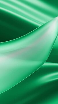 Silky green fabric folds swirl under bright light, creating serenity