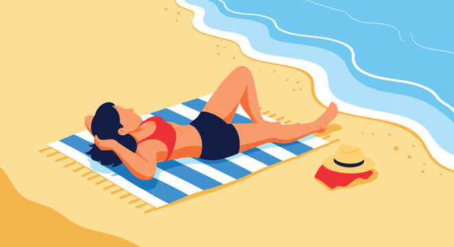 Young woman in a red swimsuit relaxing on a blue striped towel while sunbathing on a sunny sandy beach by the sea.