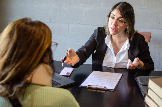 Attorney offering settlement contract to injured client during consultation