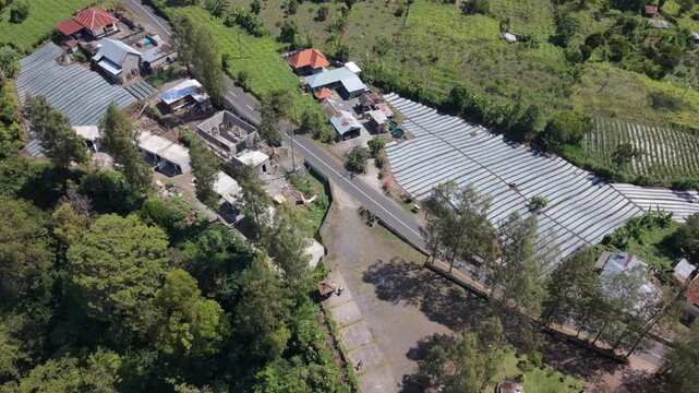 Aerial View of Rural Village Houses and Agricultural Greenhouses in Pinggan, Bali