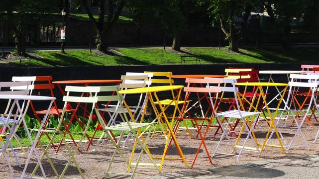 Scenic views of the lake, colorful tables for a picnic or restaurant.