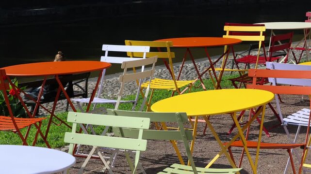 Scenic views of the lake, colorful tables for a picnic or restaurant.