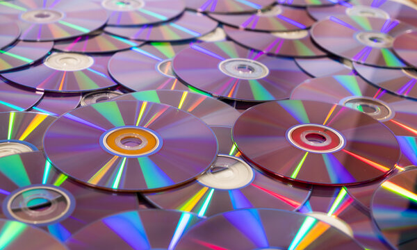 Compact discs scattered showing iridescent rainbow colors
