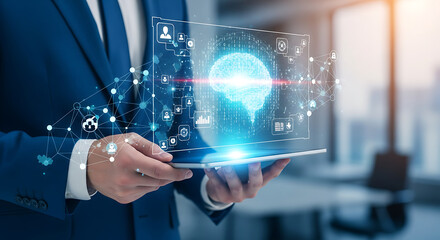 Fototapeta premium Businessman holding a tablet displaying a holographic brain and network, symbolizing AI and digital innovation in a modern office setting.