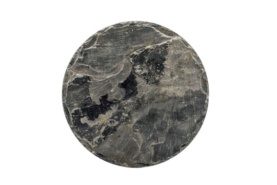 Circular piece of polished dark grey marble stone with natural white veining patterns isolated on a transparent background