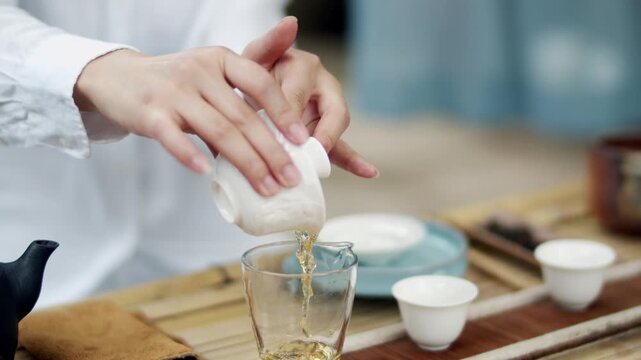 Hands Preparing Tea During Traditional Tea Ceremony