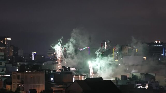 Spectacular Tet Fireworks Show over city Skyline at Night