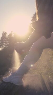 Woman Applying Insect Repellent Before Running Hiking Walking or Outdoor Recreation at Sunset