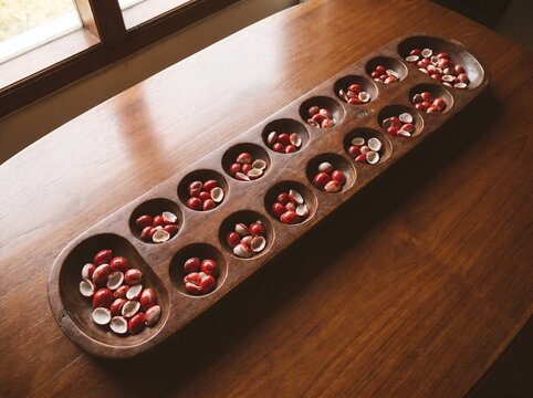 Traditional Mancala Board Game with Seeds Ready for Play