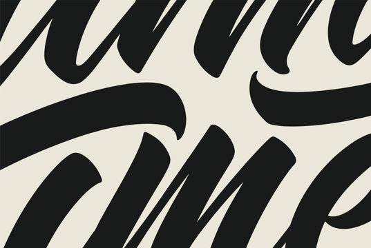 Close up shot of bold black brush calligraphy lettering on an off-white background focusing on the curves and strokes of the font.
