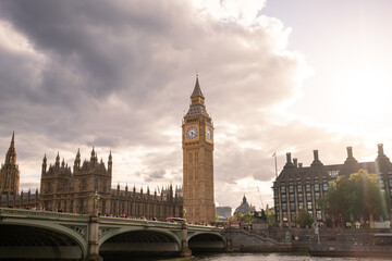 Fototapeta premium Big Ben and the House of Commons glowing in warm golden hour lig