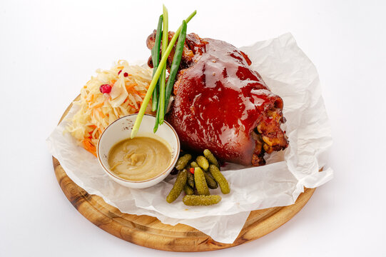 Roasted pork knuckle with sauerkraut and pickles