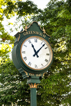 Close up of a vintage green street clock in Greenwich Connecticut