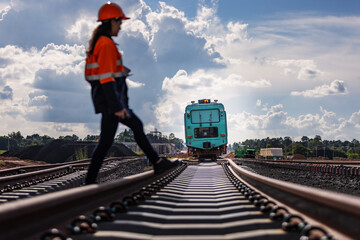 Naklejka premium Railway Engineer Crossing Tracks During Inspection of Rail Construction and Maintenance Vehicle