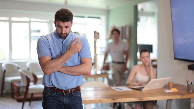 Oppressed male office employee is ridiculed, reproached, and humiliated by colleagues. Phenomenon of bullying in team, toxic atmosphere in team.