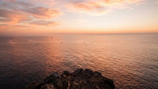 Summer sunset golden hour cliff ocean view aerial perspective peaceful dramatic coastal scene for poster design background wallpaper banner template