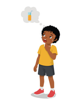 Little African boy feels thirsty thinking about drinking a glass of orange juice