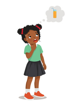 Little African girl feels thirsty thinking about drinking a glass of orange juice
