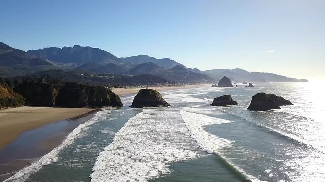 Coastal Oregon landscape featuring Cannon beach haystack rock and dramatic mountain scenery.