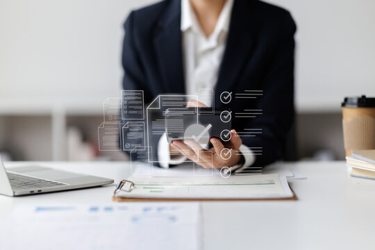 Business woman Documents, Business analysis summary graph reports of business operating expenses and work data about the company's financial statements.
