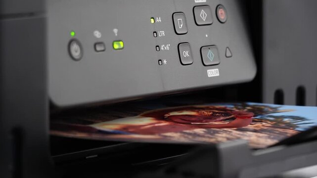 Printer ejects vibrant, detailed video with smooth motion. Control panel glows softly as operation completes. Image colors pop with vivid realism. Perfect for creative projects needing visual impact