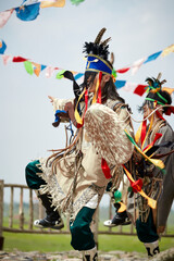 Obraz premium Dancers performing Mongolian shamanic rituals on the grasslands
